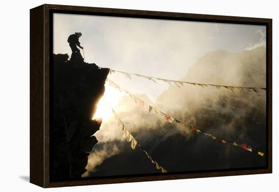 Climber on Kala Pattar Peak (5545M) with Buddhist Prayer Flags at Sunset, Nepal, Himalaya-Enrique Lopez-Tapia-Framed Premier Image Canvas