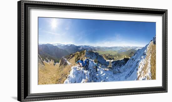 Climbers on steep crest covered with snow in the Ammergau Alps, Tegelberg, Fussen, Bavaria, Germany-Roberto Moiola-Framed Photographic Print