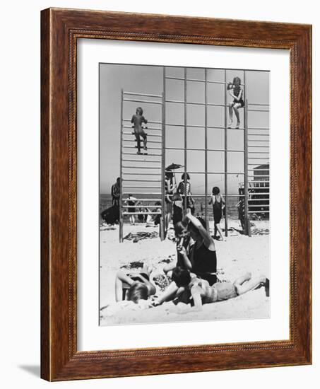 Climbing Frames on the Beach and a Family on Holiday in Warnemunde, Germany in 1936-Robert Hunt-Framed Photographic Print