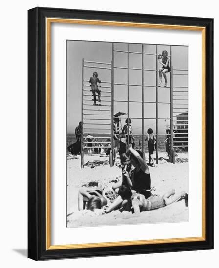 Climbing Frames on the Beach and a Family on Holiday in Warnemunde, Germany in 1936-Robert Hunt-Framed Photographic Print
