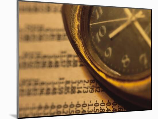 Clock on Newspaper Stock Market Report-null-Mounted Photographic Print