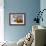 Close-Up Low Angle View of Brown Cow Against Blue Sky-null-Framed Photo displayed on a wall