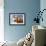 Close-Up Low Angle View of Brown Cow Against Blue Sky-null-Framed Photo displayed on a wall