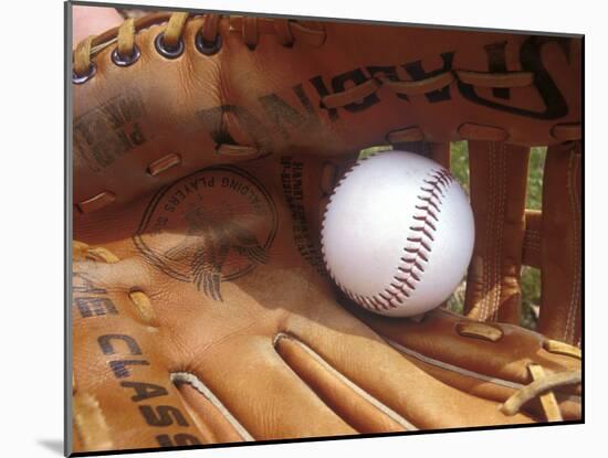 Close-up of a Baseball in a Glove-null-Mounted Photographic Print