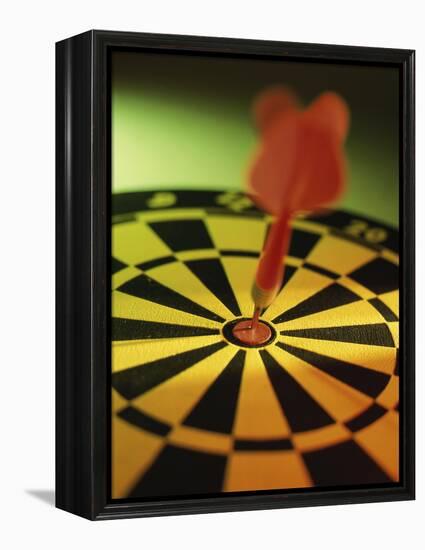Close-up of a Dart in the Bull's-Eye of a Dartboard-null-Framed Premier Image Canvas