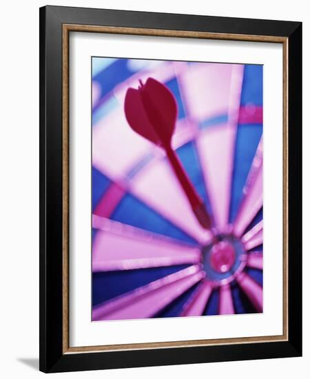 Close-up of a Dart in the Bull's-Eye of a Dartboard-null-Framed Photographic Print