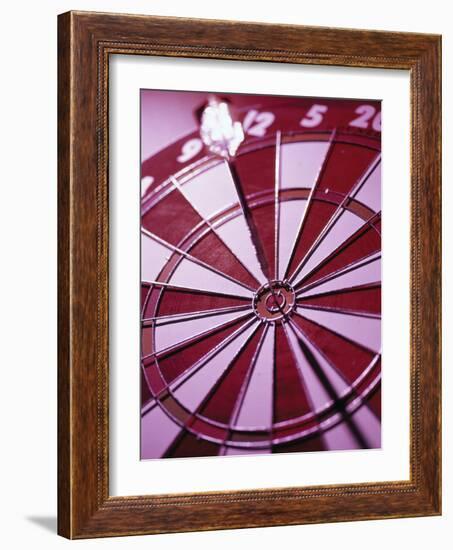 Close-up of a Dart in the Bull's-Eye of a Dartboard-null-Framed Photographic Print