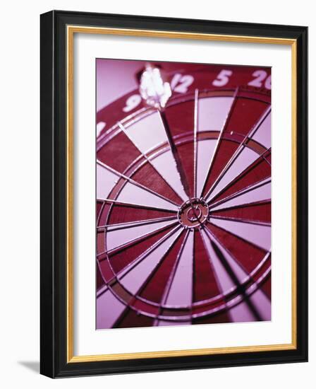 Close-up of a Dart in the Bull's-Eye of a Dartboard-null-Framed Photographic Print