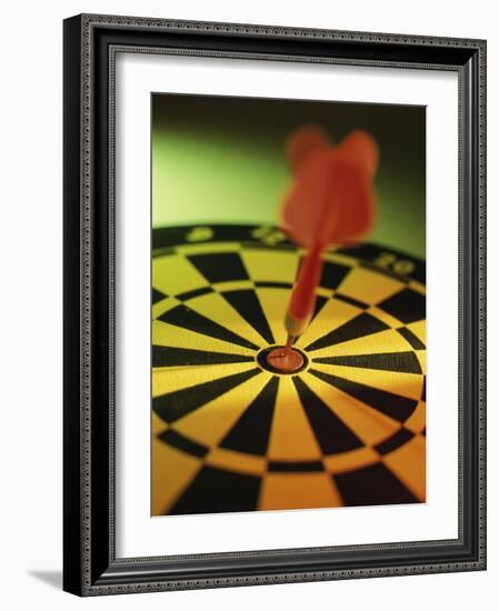 Close-up of a Dart in the Bull's-Eye of a Dartboard-null-Framed Photographic Print