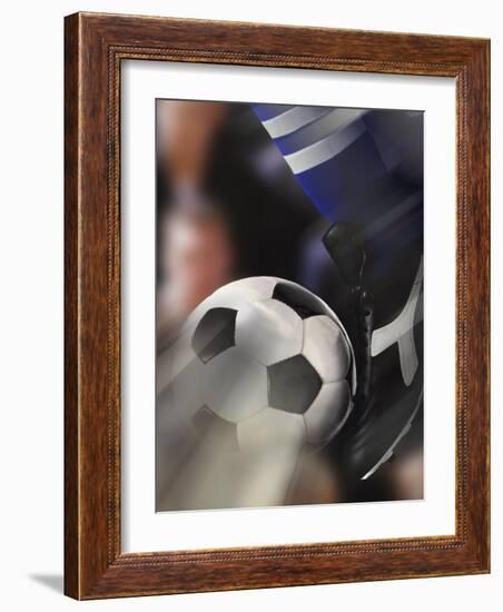 Close-up of a Soccer Player Kicking a Soccer Ball-null-Framed Photographic Print