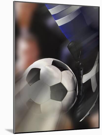 Close-up of a Soccer Player Kicking a Soccer Ball-null-Mounted Photographic Print