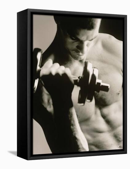 Close-up of a Young Man Working Out with a Dumbbell-null-Framed Premier Image Canvas