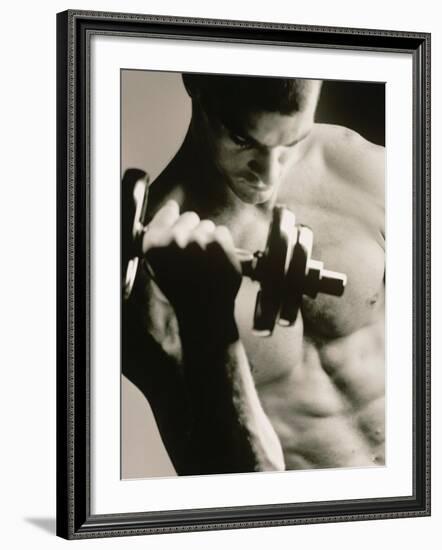 Close-up of a Young Man Working Out with a Dumbbell--Framed Photographic Print