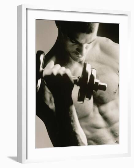 Close-up of a Young Man Working Out with a Dumbbell--Framed Photographic Print