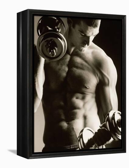 Close-up of a Young Man Working Out with Dumbbells-null-Framed Premier Image Canvas