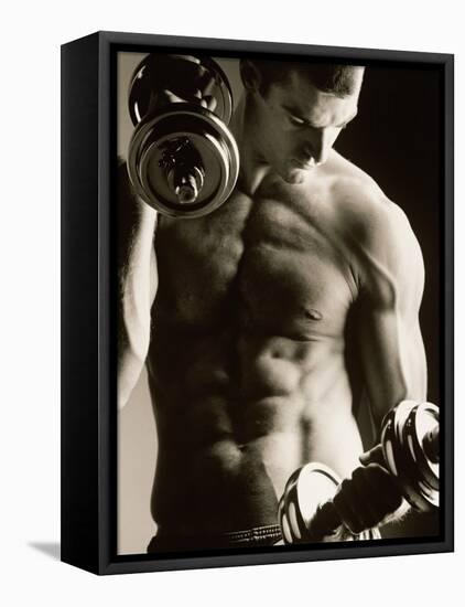 Close-up of a Young Man Working Out with Dumbbells-null-Framed Premier Image Canvas