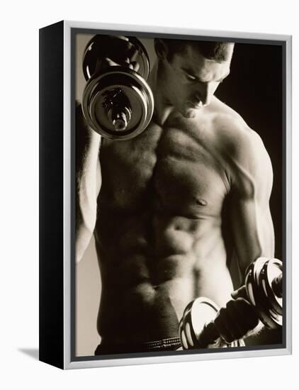 Close-up of a Young Man Working Out with Dumbbells-null-Framed Premier Image Canvas