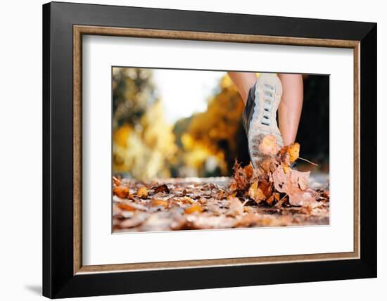 Close up of Feet of a Runner Running in Autumn Leaves Training for Marathon and Fitness Healthy Lif-warrengoldswain-Framed Photographic Print