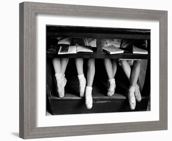 Close Up of Legs of Young Ballerinas in Toe Shoes under Desk at La Scala Ballet School-Alfred Eisenstaedt-Framed Photographic Print