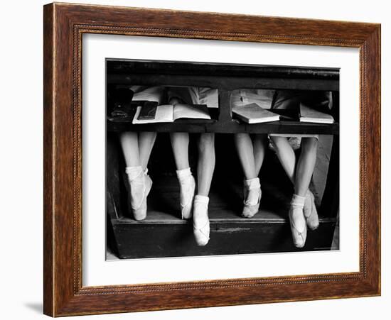 Close Up of Legs of Young Ballerinas in Toe Shoes under Desk at La Scala Ballet School-Alfred Eisenstaedt-Framed Photographic Print