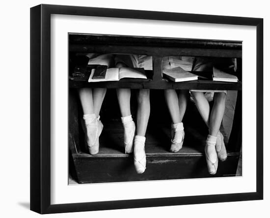 Close Up of Legs of Young Ballerinas in Toe Shoes under Desk at La Scala Ballet School-Alfred Eisenstaedt-Framed Photographic Print