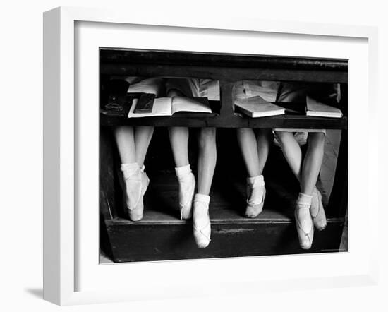 Close Up of Legs of Young Ballerinas in Toe Shoes under Desk at La Scala Ballet School-Alfred Eisenstaedt-Framed Photographic Print