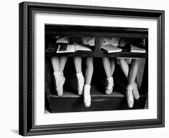 Close Up of Legs of Young Ballerinas in Toe Shoes under Desk at La Scala Ballet School-Alfred Eisenstaedt-Framed Photographic Print