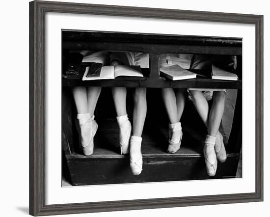 Close Up of Legs of Young Ballerinas in Toe Shoes under Desk at La Scala Ballet School-Alfred Eisenstaedt-Framed Photographic Print