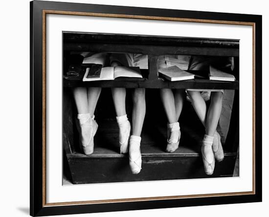 Close Up of Legs of Young Ballerinas in Toe Shoes under Desk at La Scala Ballet School-Alfred Eisenstaedt-Framed Photographic Print