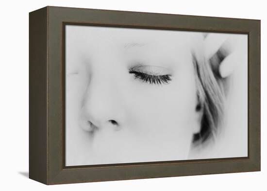 Close-Up of One Side of Young Woman's Face with Focus on the Eyelashes of Her Closed Eye-Henriette Lund Mackey-Framed Premier Image Canvas