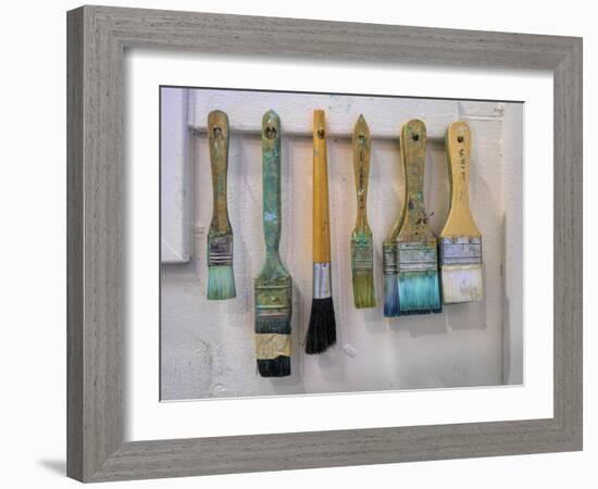 Close-up of paint brushes hanging on wall at an artist studio, California, USA-Panoramic Images-Framed Photographic Print