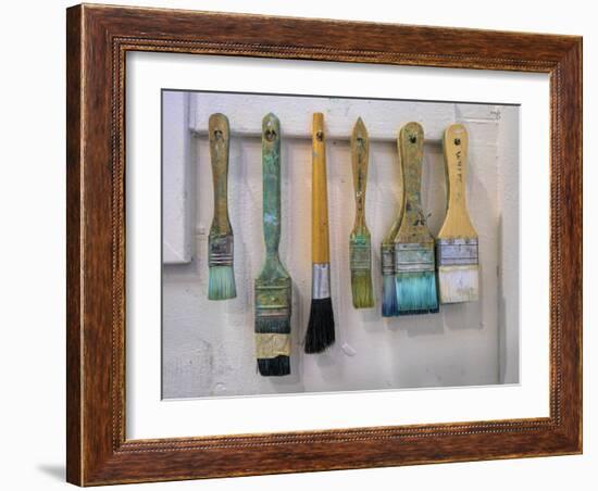 Close-up of paint brushes hanging on wall at an artist studio, California, USA-Panoramic Images-Framed Photographic Print