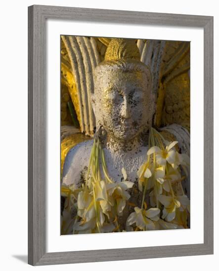 Close up of Small Buddha Figure with Flowers Round the Neck in the Shwedagon Paya, Yangon, Myanmar-Eitan Simanor-Framed Photographic Print