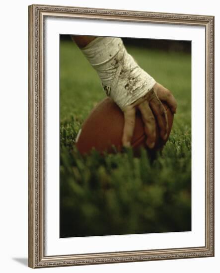 Close-up of the Hand of an American Football Player Holding a Football-null-Framed Photographic Print