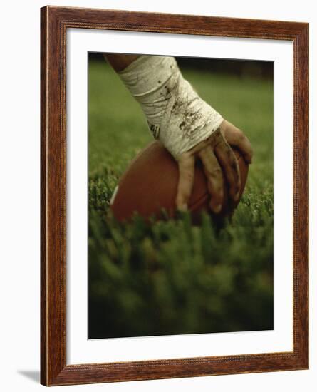 Close-up of the Hand of an American Football Player Holding a Football-null-Framed Photographic Print