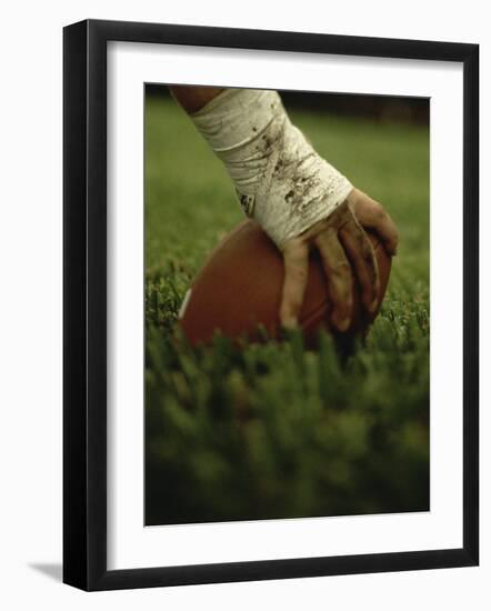 Close-up of the Hand of an American Football Player Holding a Football-null-Framed Photographic Print