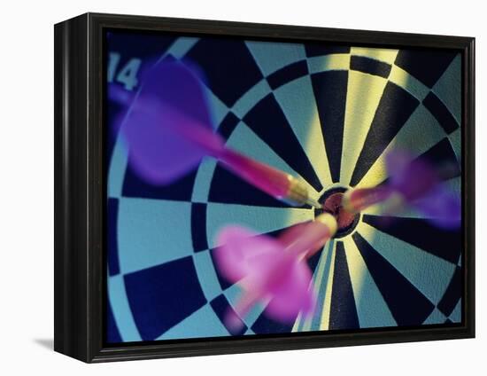 Close-up of Three Darts in the Bull's-Eye of a Dartboard-null-Framed Premier Image Canvas