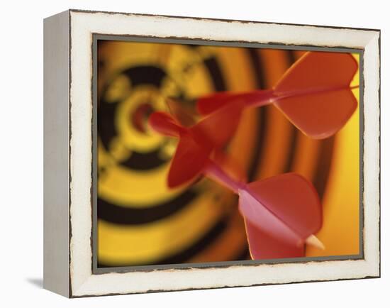 Close-up of Three Darts in the Bull's-Eye of a Dartboard-null-Framed Premier Image Canvas