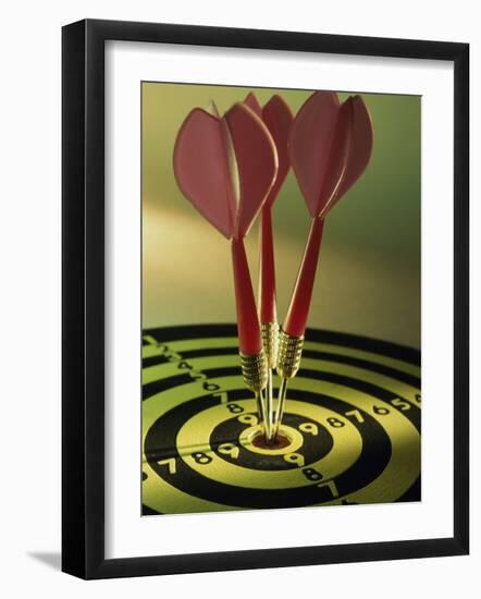 Close-up of Three Darts in the Bull's-Eye of a Dartboard-null-Framed Photographic Print