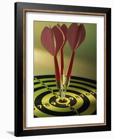 Close-up of Three Darts in the Bull's-Eye of a Dartboard-null-Framed Photographic Print