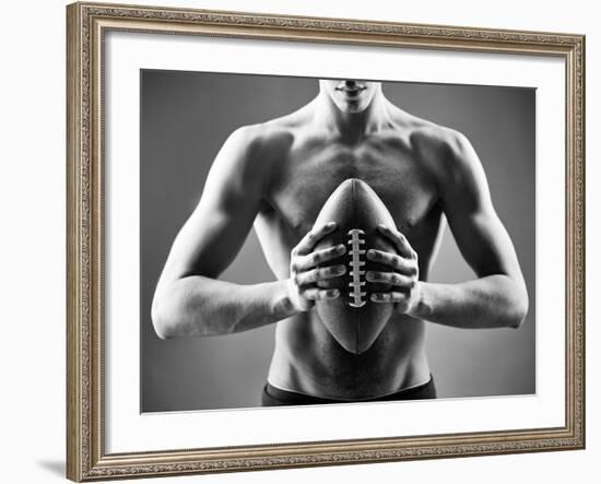 Close-Up of Topless Man Holding Rugby Ball in Isolation-pressmaster-Framed Photographic Print