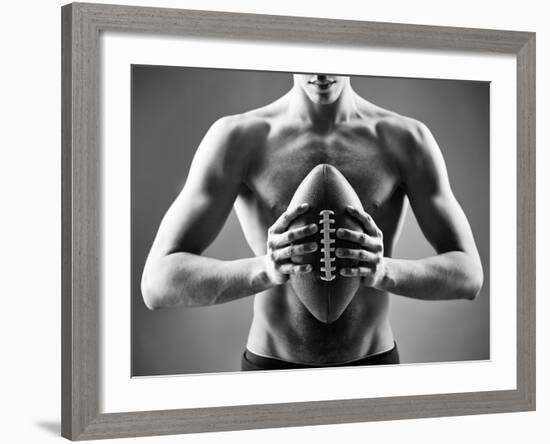 Close-Up of Topless Man Holding Rugby Ball in Isolation-pressmaster-Framed Photographic Print