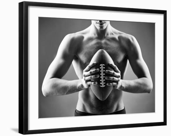 Close-Up of Topless Man Holding Rugby Ball in Isolation-pressmaster-Framed Photographic Print