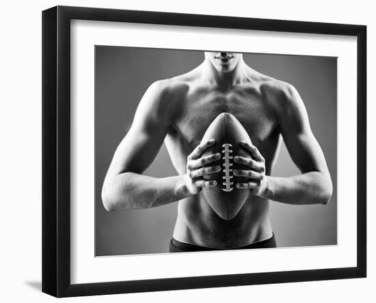 Close-Up of Topless Man Holding Rugby Ball in Isolation-pressmaster-Framed Photographic Print