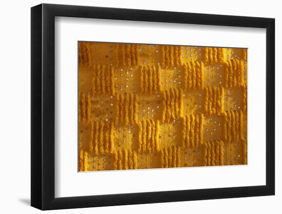 Close-up of vertical rug, hanged to the wall, used as decoration.-Michele Molinari-Framed Photographic Print