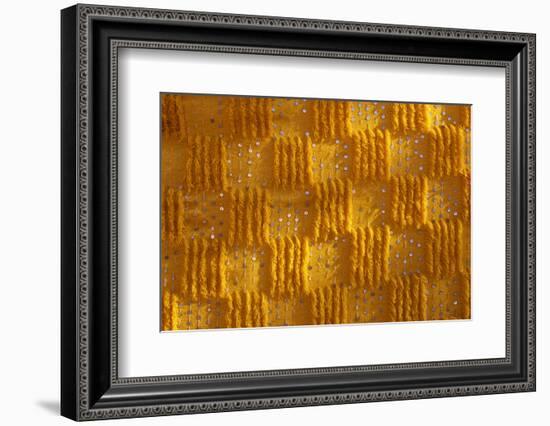 Close-up of vertical rug, hanged to the wall, used as decoration.-Michele Molinari-Framed Photographic Print
