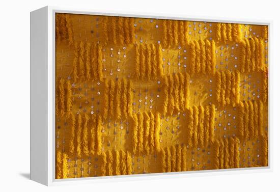 Close-up of vertical rug, hanged to the wall, used as decoration.-Michele Molinari-Framed Premier Image Canvas