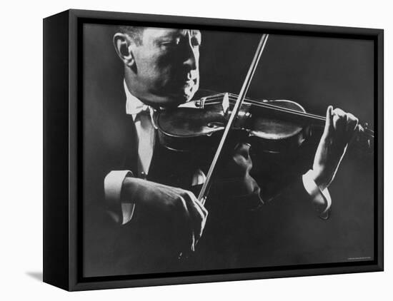 Close Up of Violinist Jascha Heifetz Playing in Mili's Darkened Studio-Gjon Mili-Framed Premier Image Canvas