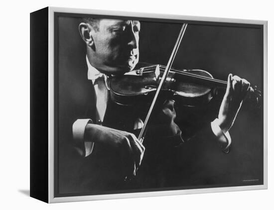 Close Up of Violinist Jascha Heifetz Playing in Mili's Darkened Studio-Gjon Mili-Framed Premier Image Canvas