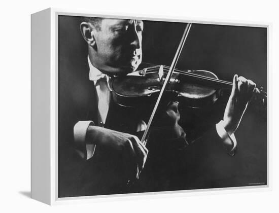 Close Up of Violinist Jascha Heifetz Playing in Mili's Darkened Studio-Gjon Mili-Framed Premier Image Canvas